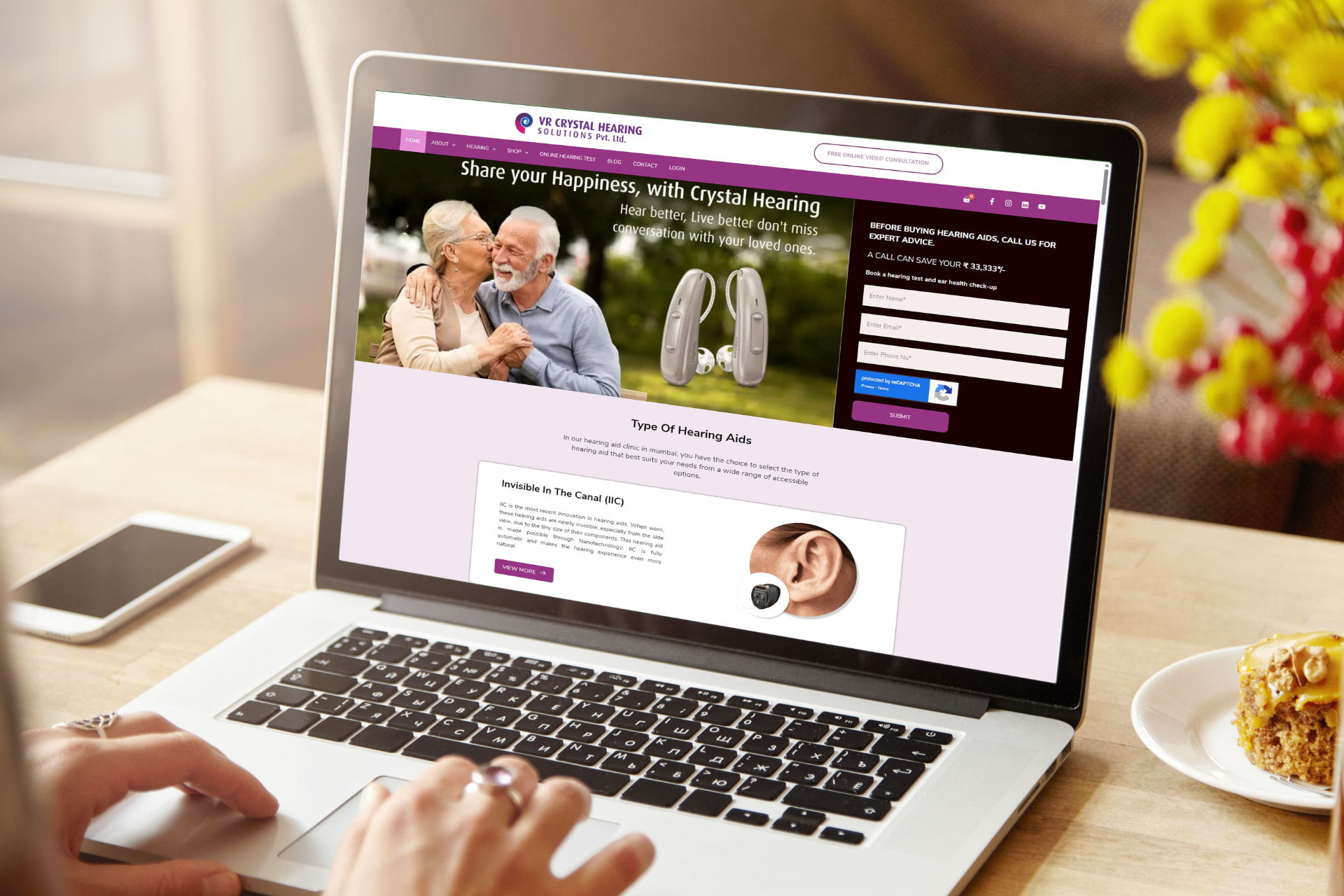 VR Crystal Hearing Solutions website homepage on a laptop